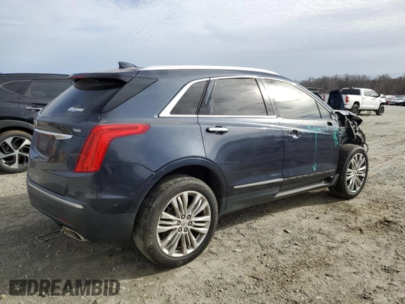 2017 Cadillac XT5 Premium Luxury FWD with VIN 1GYKNCRS5HZ198298, listed as a Copart auction lot 48212495 with 95,648 mi miles and Salvage Title. Bid and sale history available at DreamBid. Image 3.