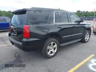 2015 Chevrolet Tahoe LT with VIN 1GNSCBKC4FR145119, listed as a IAAI auction lot 42309931 with 99,408 mi miles and . Bid and sale history available at DreamBid. Image 4.