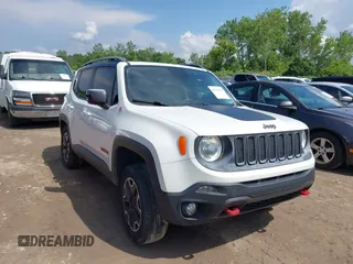 2015 Jeep Renegade Trailhawk z VIN ZACCJBCT0FPB21917, wystawiony jako IAAI lot #42529215 z przebiegiem 196 834 mil mil oraz . Historia ofert i sprzedaży dostępna na DreamBid. Obrazek 1.