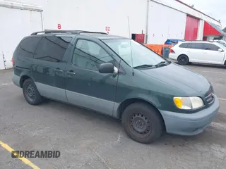2002 Toyota Sienna LE with VIN 4T3ZF13C42U437158, listed as a IAAI auction lot 42501215 with 214,415 mi miles and . Bid and sale history available at DreamBid. Image 1.