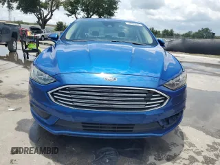 2017 Ford Fusion Hybrid SE z VIN 3FA6P0LU6HR319103, wystawiony jako Copart lot #58494695 z przebiegiem 104 483 mil mil oraz Szkoda całkowita • Salvage title. Historia ofert i sprzedaży dostępna na DreamBid. Obrazek 5.