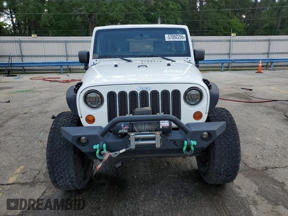 2010 Jeep Wrangler Unlimited Rubicon with VIN 1J4BA6H10AL176014, listed as a Copart auction lot 57092255 with 138,253 mi miles and Salvage title. Bid and sale history available at DreamBid. Image 5.