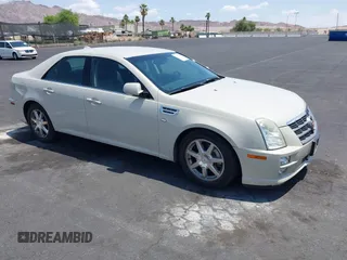 2010 Cadillac STS AWD z VIN 1G6DU6EV5A0147190, wystawiony jako IAAI lot #42432227 z przebiegiem 132 965 mil mil oraz . Historia ofert i sprzedaży dostępna na DreamBid. Obrazek 1.