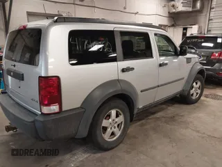 2007 Dodge Nitro SXT with VIN 1D8GU28K47W569317, listed as a IAAI auction lot 41740052 with 220,265 mi miles. Bid and sale history available at carsss.com. Image 4.