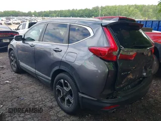 2018 Honda CR-V Touring z VIN 7FARW1H9XJE040530, wystawiony jako IAAI lot #42227446 z przebiegiem 101 299 mil mil oraz . Historia ofert i sprzedaży dostępna na DreamBid. Obrazek 3.