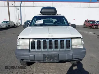 1996 Jeep Grand Cherokee Laredo z VIN 1J4GZ58Y5TC186403, wystawiony jako IAAI lot #41562270 z przebiegiem 205 797 mil mil oraz . Historia ofert i sprzedaży dostępna na DreamBid. Obrazek 6.