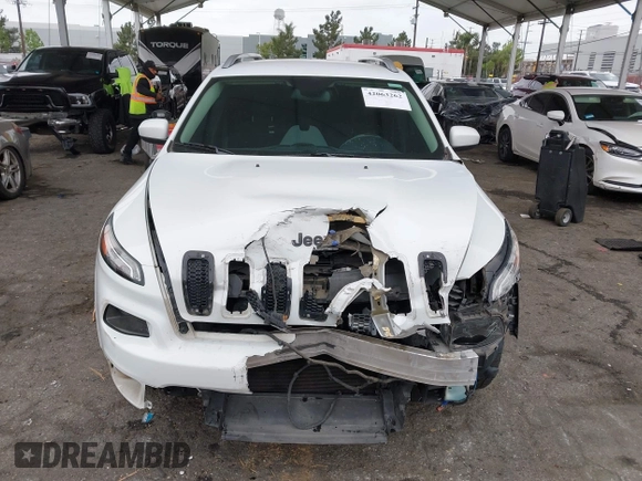2015 Jeep Cherokee Latitude with VIN 1C4PJLCB5FW642701, listed as a IAAI auction lot 42063262 with 142,501 mi miles and . Bid and sale history available at carsss.com. Image 12.