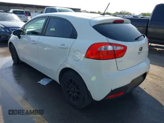 2015 Kia Rio LX with VIN KNADM5A39F6500074, listed as a IAAI auction lot 41871224 with 126,209 mi miles. Bid and sale history available at carsss.com. Image 3.