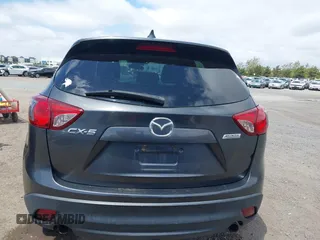 2014 Mazda CX-5 Sport with VIN JM3KE2BE0E0411377, listed as a IAAI auction lot 42143229 with 137,384 mi miles and . Bid and sale history available at carsss.com. Image 16.