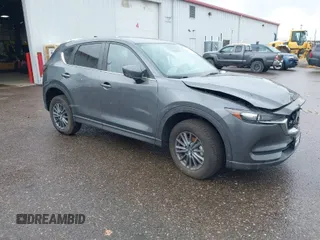 2021 Mazda CX-5 Touring with VIN JM3KFBCM8M0311433, listed as a IAAI auction lot 40554094 with 23,319 mi miles. Bid and sale history available at carsss.com. Image 1.