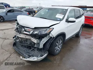 2021 Honda Pilot EX-L with VIN 5FNYF6H55MB031305, listed as a IAAI auction lot 41476636 with 58,754 mi miles. Bid and sale history available at carsss.com. Image 2.
