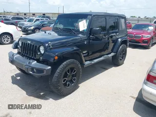 2015 Jeep Wrangler Unlimited Sahara with VIN 1C4HJWEG6FL572674, listed as a IAAI auction lot 42736266 with 97,024 mi miles and . Bid and sale history available at DreamBid. Image 17.