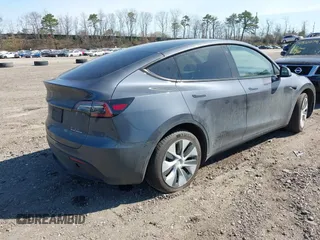 2022 Tesla Model Y Long Range with VIN 7SAYGDEE2NF460945, listed as a IAAI auction lot 41921645 with 62,318 mi miles and . Bid and sale history available at DreamBid. Image 4.