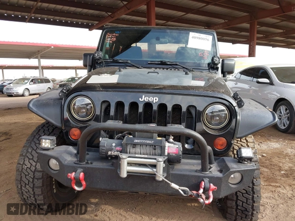 2011 Jeep Wrangler Rubicon with VIN 1J4BA6D13BL545343, listed as a IAAI auction lot 40980056 with 107,207 mi miles and . Bid and sale history available at carsss.com. Image 12.