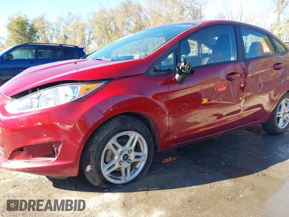 2017 Ford Fiesta SE z VIN 3FADP4BJ6HM143379, wystawiony jako IAAI lot #40863748 z przebiegiem 77 325 mil mil oraz . Historia ofert i sprzedaży dostępna na DreamBid. Obrazek 6.