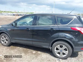 2013 Ford Escape SE with VIN 1FMCU0GX1DUA99040, listed as a IAAI auction lot 42084787 with 140,473 mi miles and . Bid and sale history available at DreamBid. Image 14.