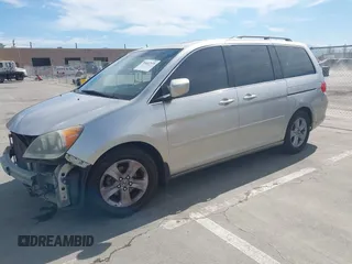 2009 Honda Odyssey Touring с VIN 5FNRL38969B013708, выставлен на аукционе IAAI как лот 42002538 с пробегом 198 220 миль миль и . История ставок и продаж доступна на DreamBid. Изображение 18.