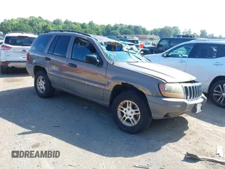 2002 Jeep Grand Cherokee Laredo z VIN 1J4GW48N12C205908, wystawiony jako IAAI lot #42702936 z przebiegiem 208 877 mil mil oraz . Historia ofert i sprzedaży dostępna na DreamBid. Obrazek 1.