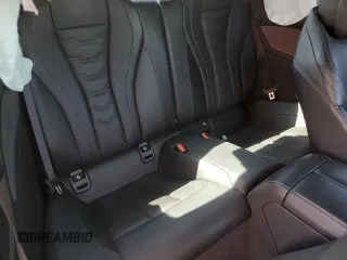 2024 BMW 8 Series 840i z VIN WBAAE4C05RCN32734, wystawiony jako Copart lot #51999545 z przebiegiem Nie podano mil oraz Szkody całkowita. Historia ofert i sprzedaży dostępna na DreamBid. Obrazek 10.