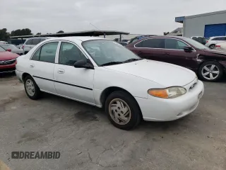 1999 Ford Escort LX with VIN 1FAFP10P7XW221648, listed as a Copart auction lot 71844334 with 140,899 mi miles and Salvage Title. Bid and sale history available at carsss.com. Image 4.