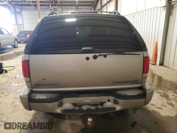 1999 Chevrolet Blazer LS with VIN 1GNCT18W8XK128169, listed as a Copart auction lot 44260965 with 104,790 mi miles and Salvage title. Bid and sale history available at DreamBid. Image 6.