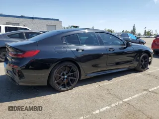 2022 BMW 8 Series M850i with VIN WBAGV8C02NCK08667, listed as a Copart auction lot 50335155 with 22,737 mi miles and Salvage title. Bid and sale history available at DreamBid. Image 3.