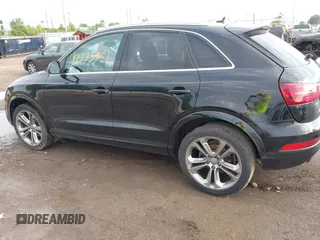 2015 Audi Q3 Premium Plus z VIN WA1EFCFS6FR001473, wystawiony jako IAAI lot #42795951 z przebiegiem 148 638 mil mil oraz . Historia ofert i sprzedaży dostępna na DreamBid. Obrazek 14.