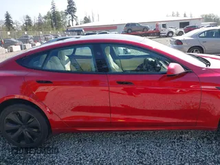 2023 Tesla Model S with VIN 5YJSA1E5XPF516779, listed as a IAAI auction lot 42110737 with 16,465 mi miles and . Bid and sale history available at DreamBid. Image 14.