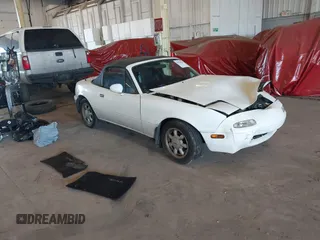 1991 Mazda MX-5 Miata Special Edition z VIN JM1NA3514M1209845, wystawiony jako IAAI lot #42028567 z przebiegiem 135 718 mil mil oraz . Historia ofert i sprzedaży dostępna na DreamBid. Obrazek 1.