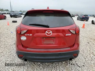 2014 Mazda CX-5 Grand Touring with VIN JM3KE2DY1E0332971, listed as a Copart auction lot 51235415 with 105,338 mi miles and Salvage Title. Bid and sale history available at carsss.com. Image 6.