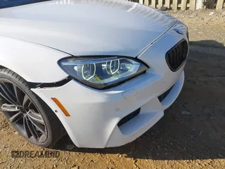 2015 BMW 6 Series 650i with VIN WBA6B2C54FGB99173, listed as a IAAI auction lot 41692594 with 123,664 mi miles and . Bid and sale history available at carsss.com. Image 18.