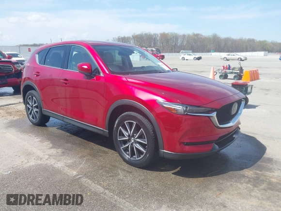 2018 Mazda CX-5 Grand Touring with VIN JM3KFBDM6J0424663, listed as a IAAI auction lot 42003207 with 95,442 mi miles and . Bid and sale history available at DreamBid. Image 1.