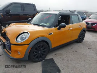 2016 MINI Hardtop 4 Door z VIN WMWXU1C56G2D10006, wystawiony jako IAAI lot #41752731 z przebiegiem 67 844 mil mil oraz . Historia ofert i sprzedaży dostępna na DreamBid. Obrazek 2.