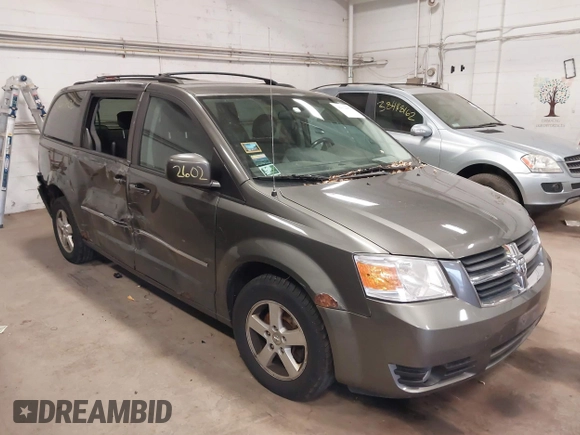 2010 Dodge Grand Caravan SXT z VIN 2D4RN5D14AR416488, wystawiony jako IAAI lot #38412602 z przebiegiem 136 997 mil mil oraz . Historia ofert i sprzedaży dostępna na DreamBid. Obrazek 1.