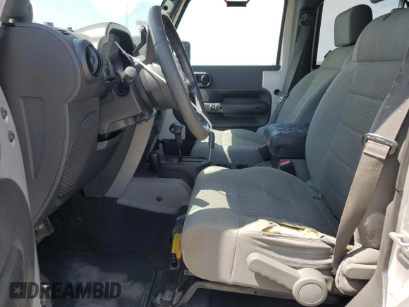 2007 Jeep Wrangler Unlimited Sahara with VIN 1J8GA59137L181360, listed as a Copart auction lot 62311225 with 151,393 mi miles and Salvage title. Bid and sale history available at DreamBid. Image 7.