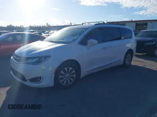 2017 Chrysler Pacifica Touring L with VIN 2C4RC1BG2HR526503, listed as a IAAI auction lot 40264571 with 136,262 mi miles and . Bid and sale history available at DreamBid. Image 2.