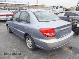 2003 Kia Rio with VIN KNADC125736236506, listed as a IAAI auction lot 41467649 with 109,975 mi miles. Bid and sale history available at carsss.com. Image 3.