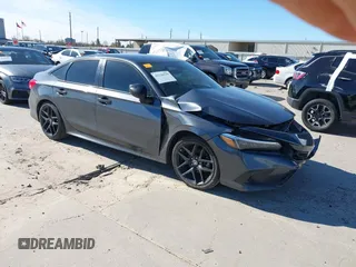 2023 Honda Civic Sport z VIN 2HGFE2F57PH531522, wystawiony jako IAAI lot #41228129 z przebiegiem 32 809 mil mil oraz . Historia ofert i sprzedaży dostępna na DreamBid. Obrazek 1.