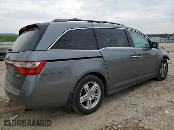 2012 Honda Odyssey Touring with VIN 5FNRL5H96CB045514, listed as a Copart auction lot 54698355 with 217,787 mi miles and Clean Title. Bid and sale history available at DreamBid. Image 3.