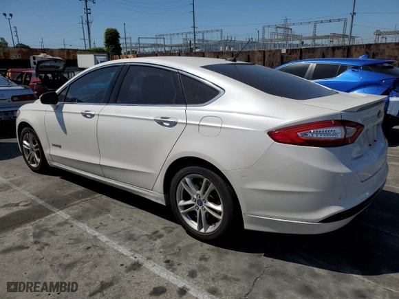 2015 Ford Fusion Titanium Hybrid with VIN 3FA6P0RUXFR245253, listed as a Copart auction lot 52189475 with 164,876 mi miles and Salvage Title. Bid and sale history available at carsss.com. Image 2.