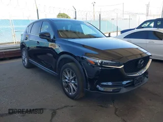 2020 Mazda CX-5 Grand Touring with VIN JM3KFADMXL0740144, listed as a IAAI auction lot 41830203 with 70,535 mi miles and . Bid and sale history available at DreamBid. Image 1.