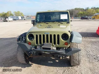 2013 Jeep Wrangler Unlimited Sport with VIN 1C4BJWDG5DL577949, listed as a IAAI auction lot 41837172 with 142,235 mi miles. Bid and sale history available at carsss.com. Image 12.