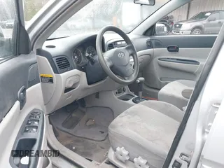 2006 Hyundai Accent GLS with VIN KMHCN46C46U035208, listed as a IAAI auction lot 41769016 with 141,065 mi miles. Bid and sale history available at carsss.com. Image 5.
