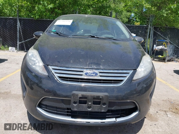 2013 Ford Fiesta SE z VIN 3FADP4BJ7DM144261, wystawiony jako IAAI lot #42281950 z przebiegiem 149 437 mil mil oraz . Historia ofert i sprzedaży dostępna na DreamBid. Obrazek 6.