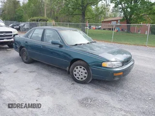1996 Toyota Camry DX with VIN 4T1BG12K3TU829839, listed as a IAAI auction lot 42085170 with 266,741 mi miles. Bid and sale history available at carsss.com. Image 1.