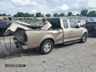 2002 Ford F-150 XL with VIN 1FTRX17L02KC02580, listed as a Copart auction lot 60859595 with 175,892 mi miles and Salvage title. Bid and sale history available at DreamBid. Image 3.