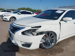2014 Nissan Altima S with VIN 1N4AL3AP5EN335473, listed as a IAAI auction lot 41952678 with 156,474 mi miles and . Bid and sale history available at DreamBid. Image 6.