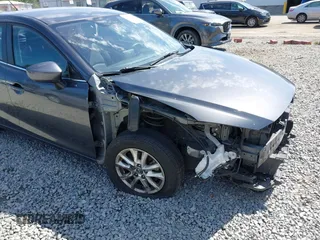 2015 Mazda 3 i Touring z VIN JM1BM1L73F1238360, wystawiony jako IAAI lot #42455285 z przebiegiem 124 319 mil mil oraz . Historia ofert i sprzedaży dostępna na DreamBid. Obrazek 6.