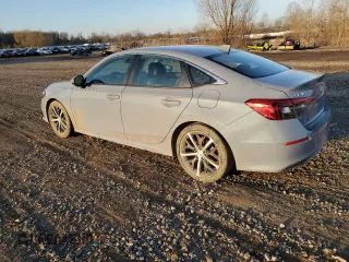 2022 Honda Civic Touring z VIN 2HGFE1F90NH324934, wystawiony jako Copart lot #48501555 z przebiegiem 99 825 mil mil oraz Szkoda całkowita • Salvage title. Historia ofert i sprzedaży dostępna na DreamBid. Obrazek 2.