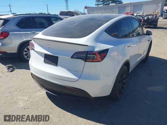 2021 Tesla Model Y Long Range with VIN 5YJYGDEE8MF125104, listed as a IAAI auction lot 41698065 with 25,177 mi miles and . Bid and sale history available at DreamBid. Image 4.